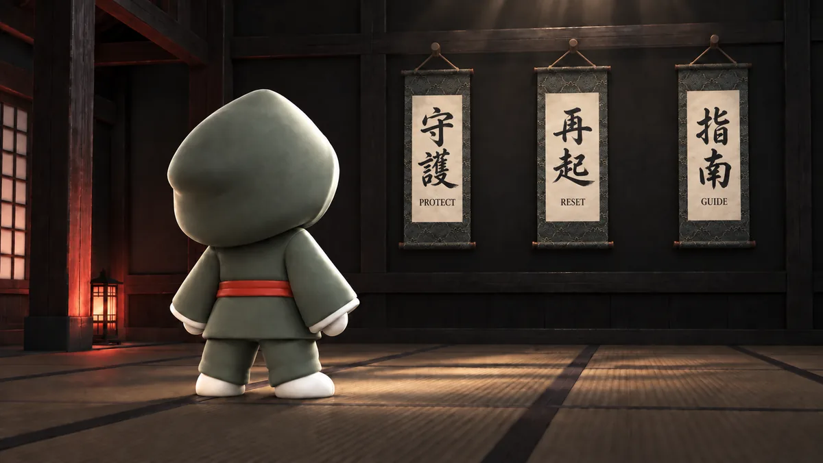 KAMI standing in a dojo before three hand-painted Japanese calligraphy scrolls for Protect, Reset and Guide
